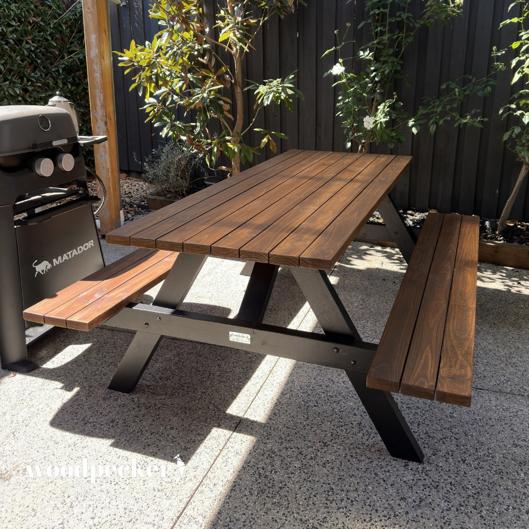 Outdoor workspace with picnic tables for business gatherings
