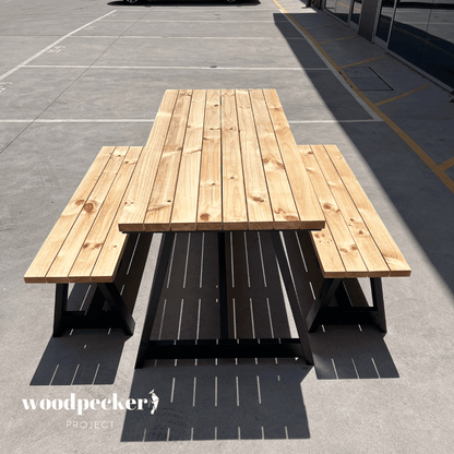 Modern outdoor table set with teak wood accents and contemporary design, offering a blend of natural beauty and modern style