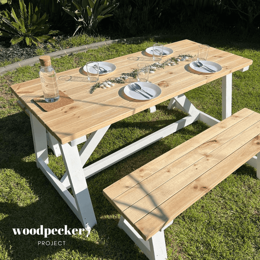 Sleek modern outdoor table set featuring a minimalist design, perfect for stylish patio dining and enhancing your outdoor space
