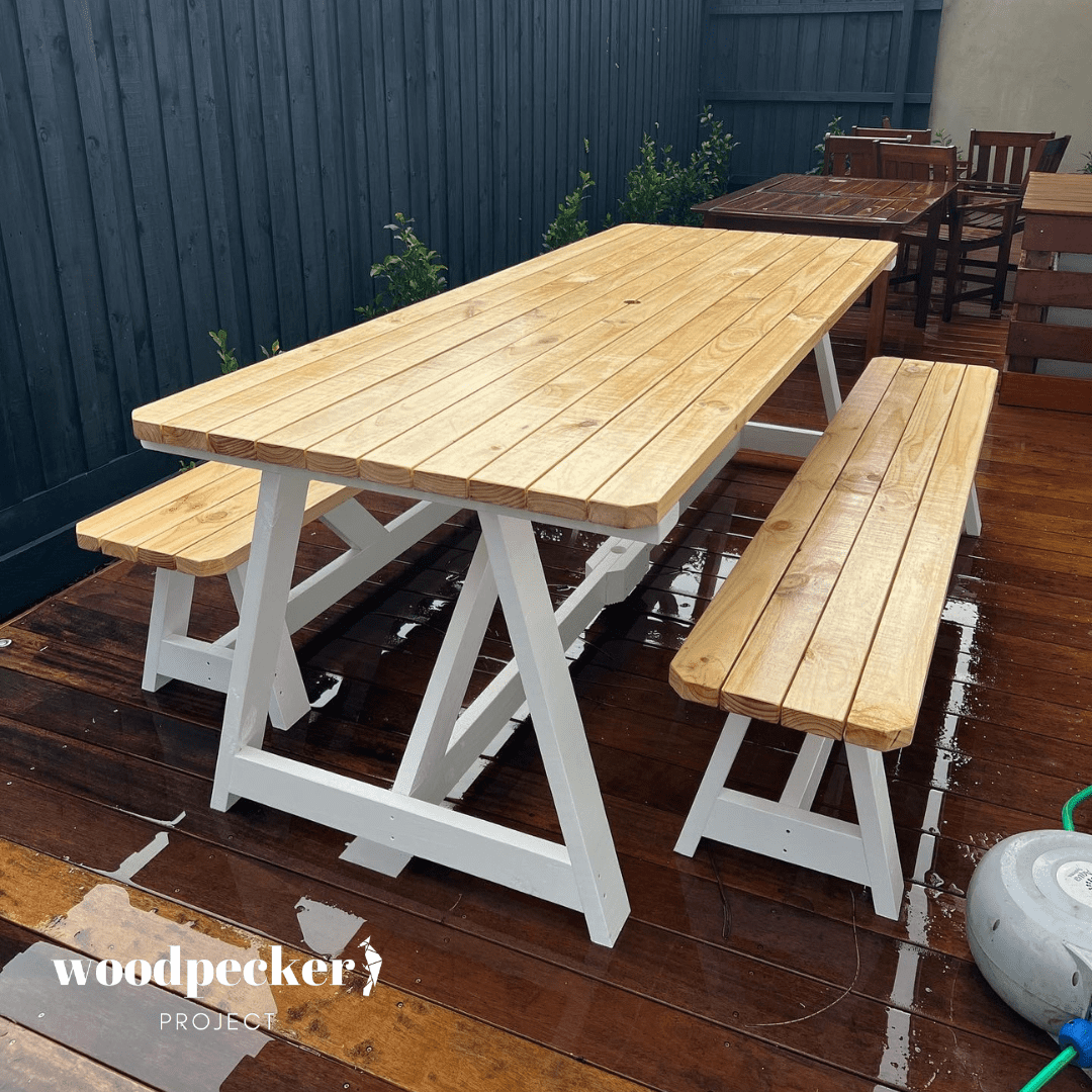 Modern outdoor table set with a fire pit centerpiece, perfect for cozy evenings and adding warmth to your outdoor gatherings